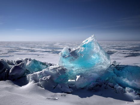 pexels-photo-666737-666737 Captivating ice formation on a frozen lake under a bright blue sky during winter.